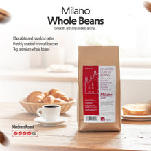 Milano coffee beans package with a background of a table setting with coffee and pastries.